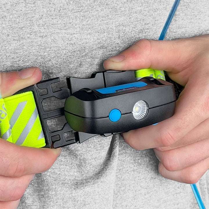 NoxGear Tracer Lamp being clipped into vest mount – front clip attachment in action