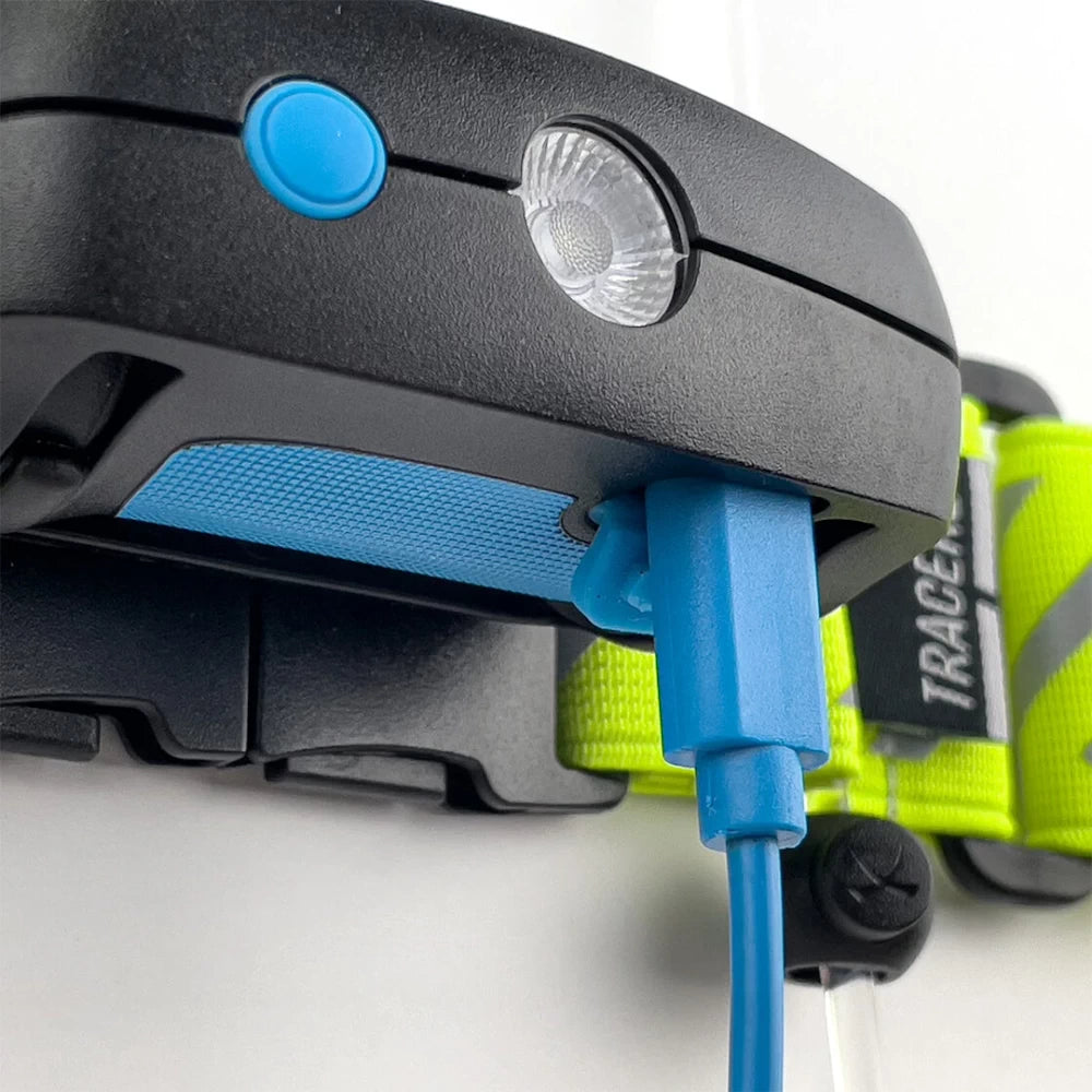 Close-up of USB-C charging cable connected to the NoxGear Tracer Lamp – rechargeable LED light detail