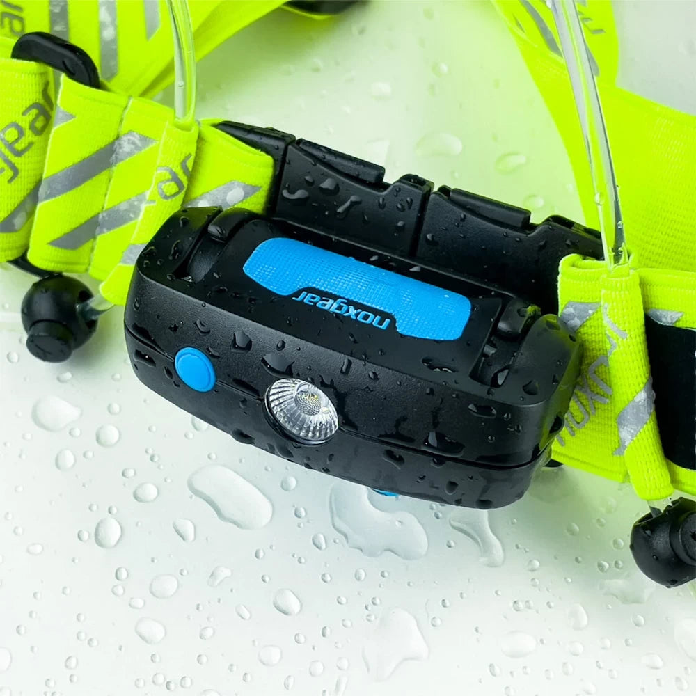Waterproof NoxGear Tracer Lamp shown with water droplets – IP64-rated light with high-visibility vest