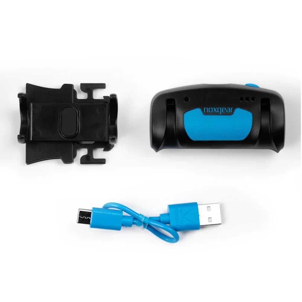Contents of the NoxGear Tracer Lamp package – includes LED lamp, clip holder, and USB-C charging cable