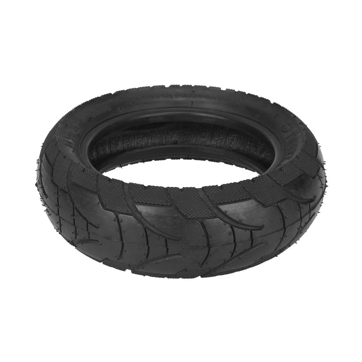 Laid flat view of the TUOVT 8.5x3 outer tyre for Vsett 9, showing internal construction, directional urban tread pattern and diamond-stippled tyre shoulder.