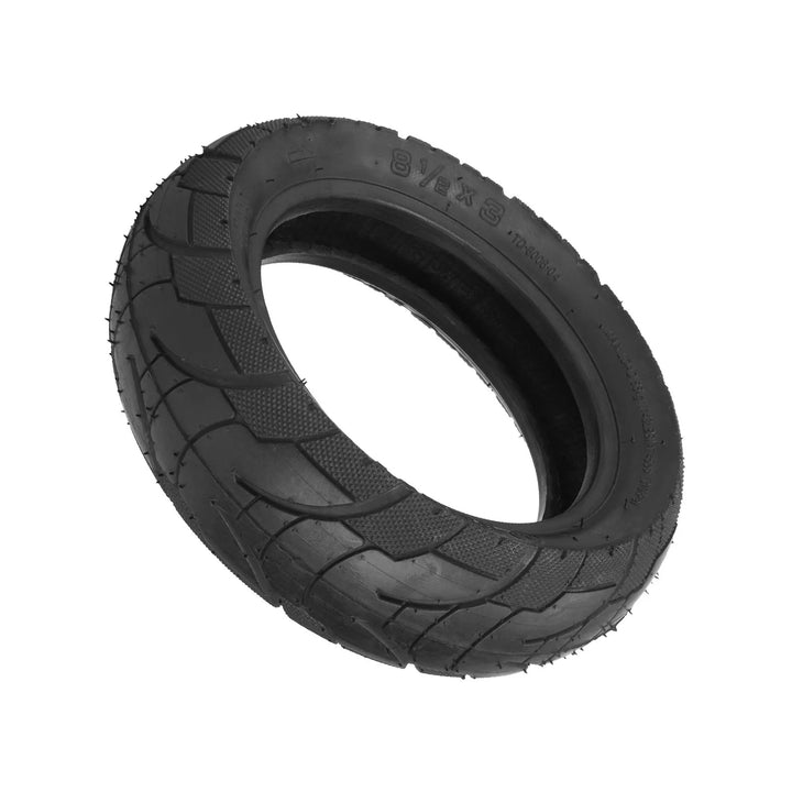 Underside view of the TUOVT 8.5x3 Outer tyre for Vsett 9, showing inner construction and tread and stippled tyre shoulder for extra grip when cornering.
