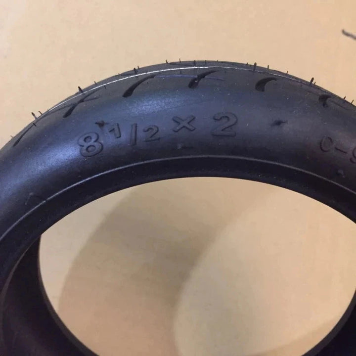 8.5-inch CST upgraded tyre for Xiaomi M365 Pro, extra thick rubber, marked with 8 1/2 x 2 size and model details.