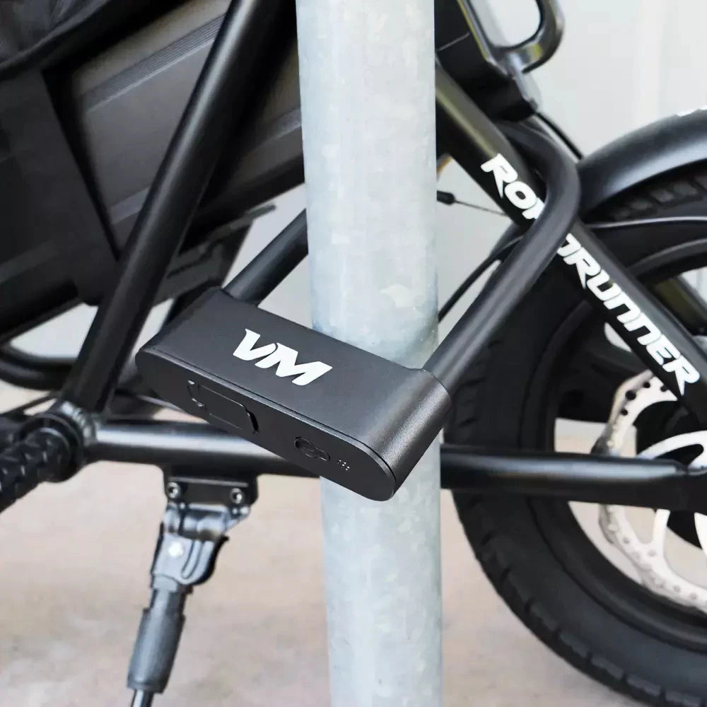 Voro Motors Fingerprint D-Lock securing a Roadrunner seated electric scooter to a pole, for safe parking and peace of mind.