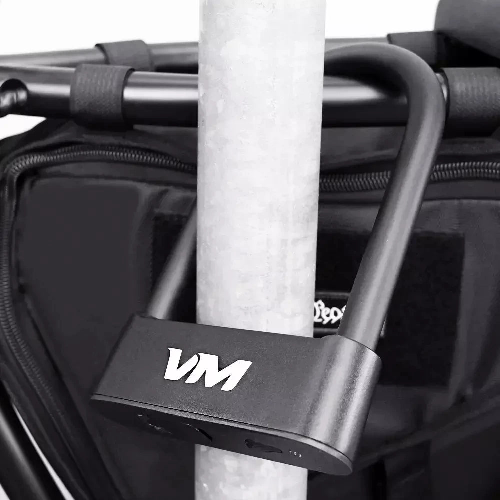 Voro Motors Fingerprint D-Lock securing an EMOVE Roadrunner to a pole, for enhanced security.