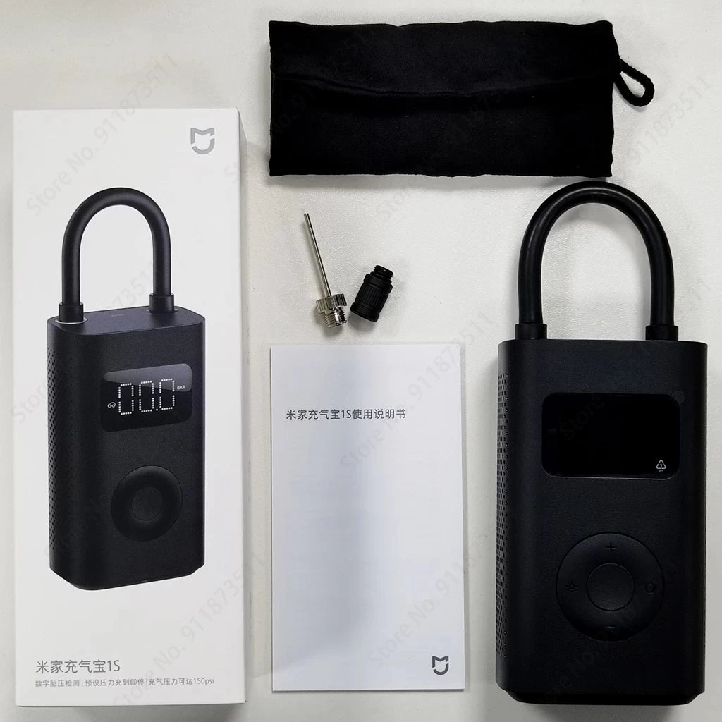 Contents of the Xiaomi 1S Digital Air Pump including carry pouch, manual (chinese) and attachments including sports ball inflation needle and Presta valve adapter.