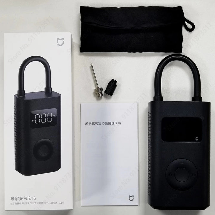 Contents of the Xiaomi 1S Digital Air Pump including carry pouch, manual (chinese) and attachments including sports ball inflation needle and Presta valve adapter.