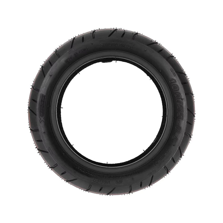 Direct side profile of Xuancheng 100/55-6.5 scooter tyre clearly displaying size imprint and bead structure for rim fitting.