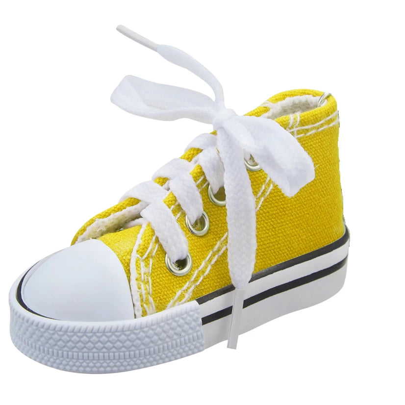 Yellow canvas kickstand shoe cover with white laces, side view.