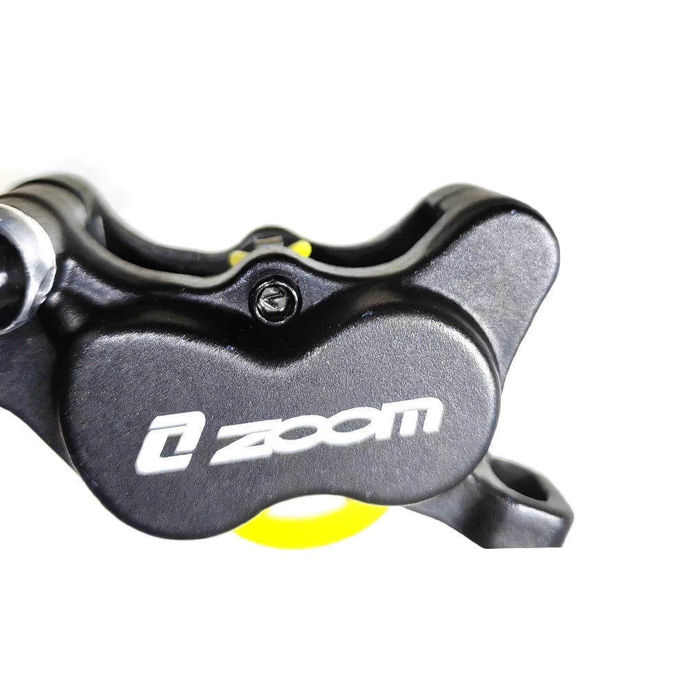 Close-up of Zoom 4-piston hydraulic brake calliper body black finish