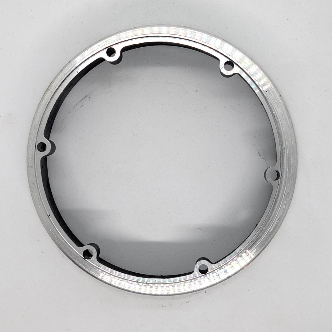 Rear flat view of genuine replacement motor hub ring for Bexly Raven (M9). Precision machined alloy with 6 mounting holes.