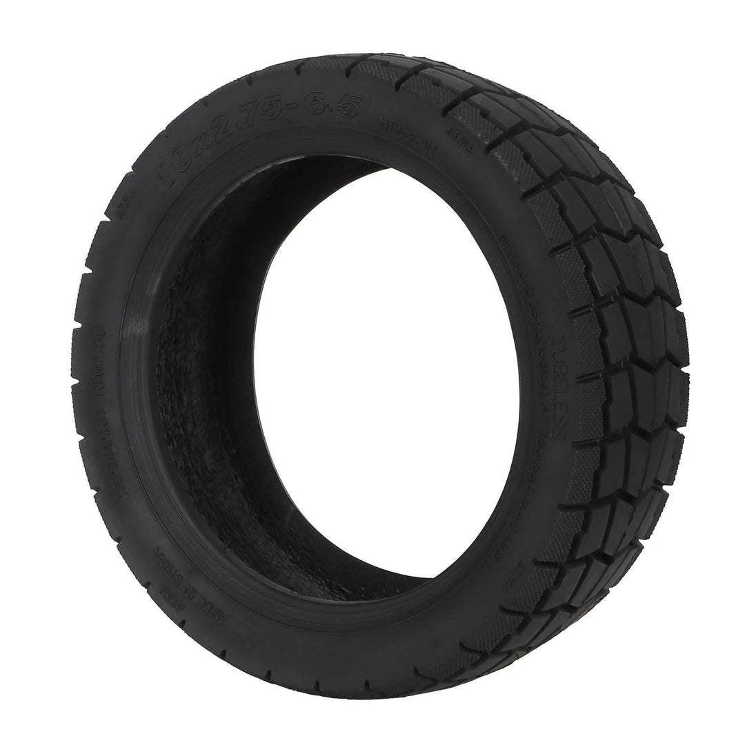 front angled view of tubeless scooter tyre with aggressive hybrid tread pattern