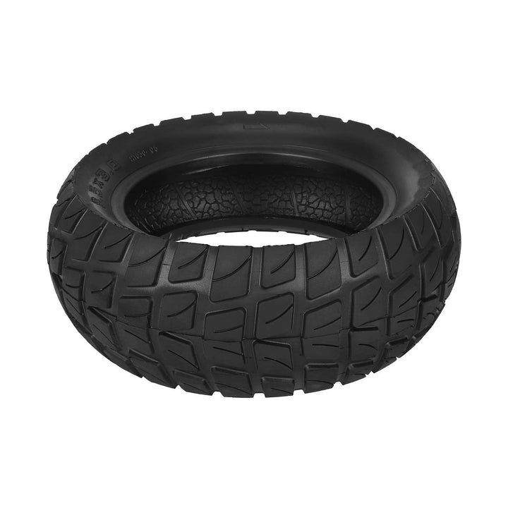 Laid flat view 8.5x3.0 tubeless electric scooter tyre showing aggressive off-road tread pattern and internal construction