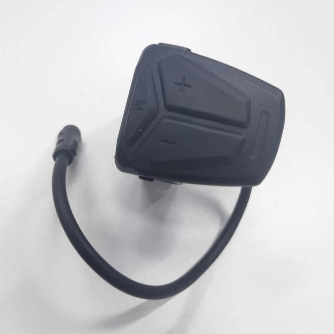Top view of original Kaabo TFT display switch with integrated cable