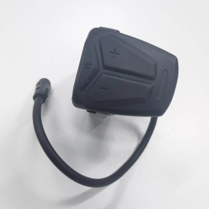 Top view of original Kaabo TFT display switch with integrated cable