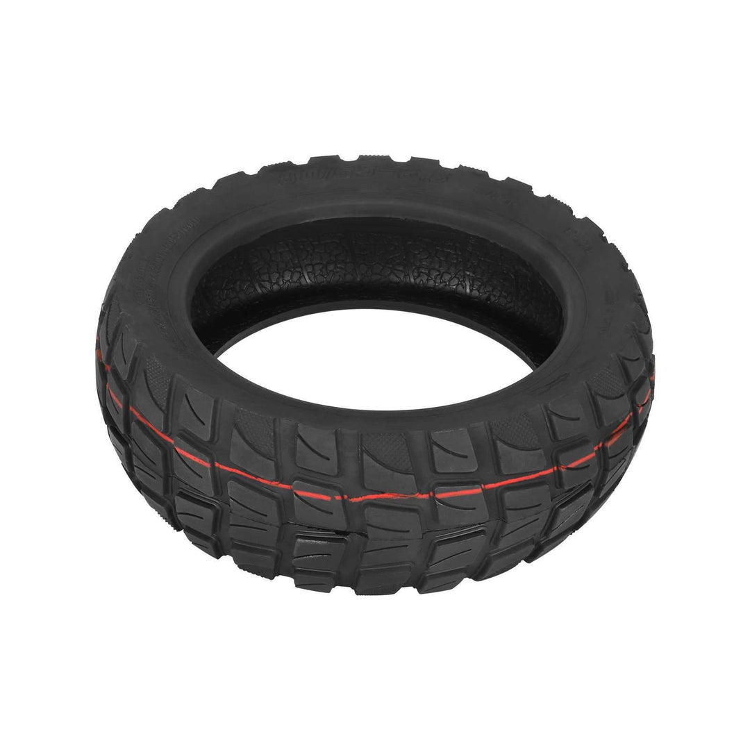 Angled tread view of 80/65-6.5 tubeless scooter tyre showing off-road blocks and grooves