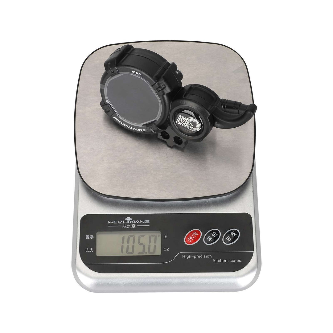 MINIMOTORS EY3 display and throttle assembly shown on scale with approximate weight of 105 grams.