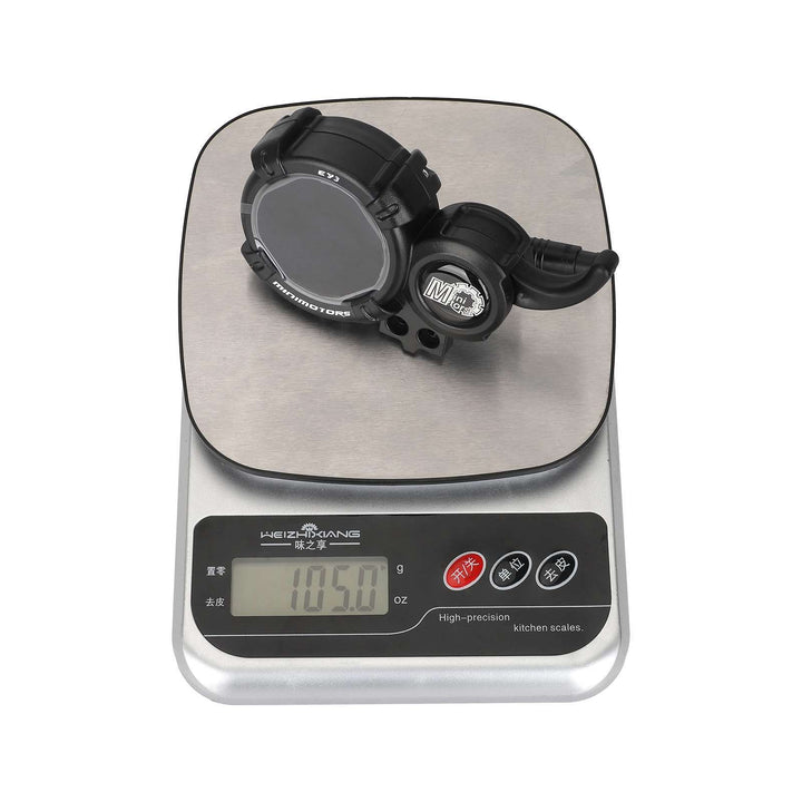 MINIMOTORS EY3 display and throttle assembly shown on scale with approximate weight of 105 grams.