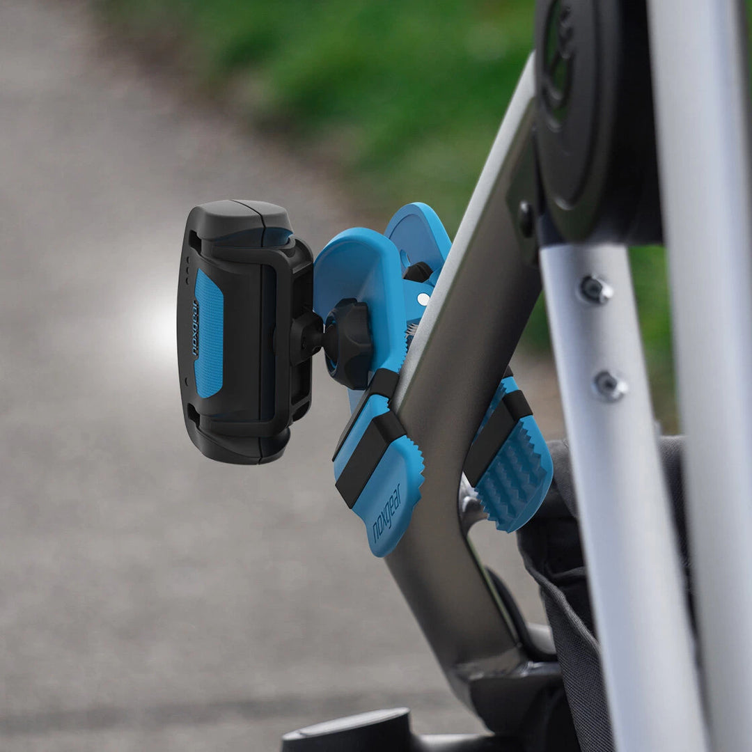 Noxgear 500 lumen rechargeable Clip Anywhere light securely clamped to stroller frame