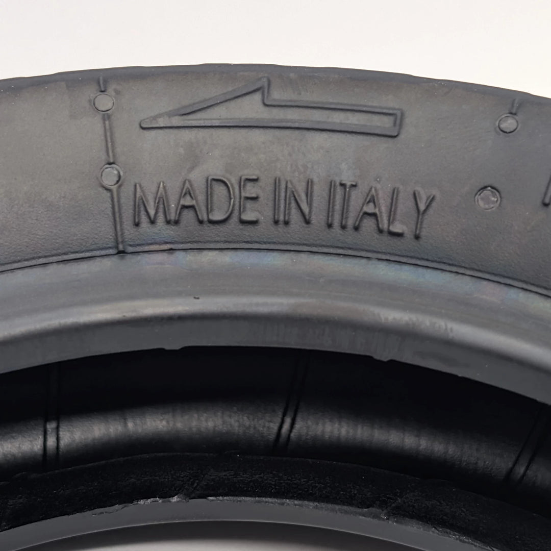 Close-up of the sidewall directional fitment arrow and "Made in Italy" embossed on PMT 10x3.0 (75/250-R6.0) E-Fire Radial Tyre/