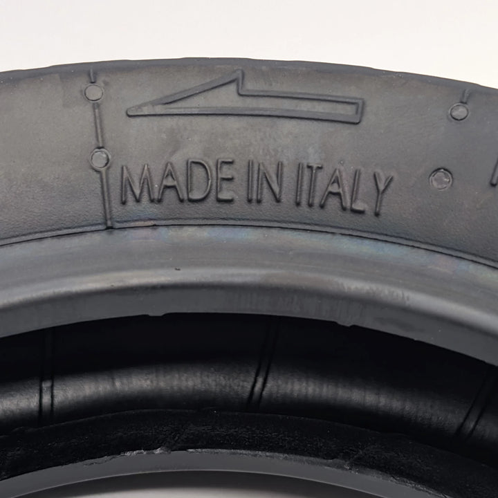 Close-up of the sidewall directional fitment arrow and "Made in Italy" embossed on PMT 10x3.0 (75/250-R6.0) E-Fire Radial Tyre/