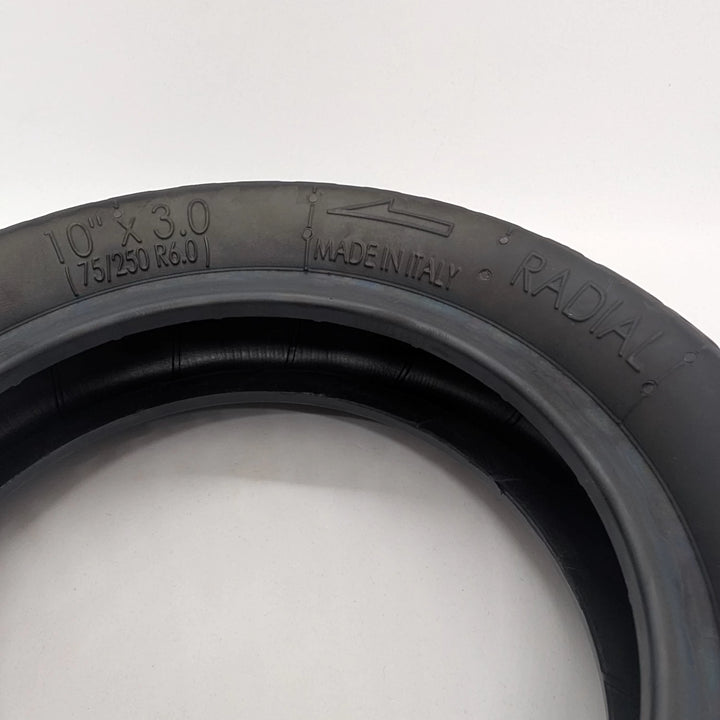 Close-up view of the embossed sizing on the sidewall of the PMT 10x3.0 (75/250-R6.0) E-Fire Radial Tyre, made in Italy.