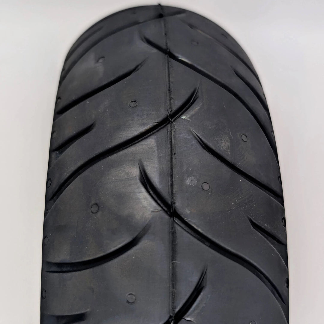 Front close-up view of the stradale tread pattern on the the PMT 10x3.0 (75/250-R6.0) E-Fire Radial Tyre.