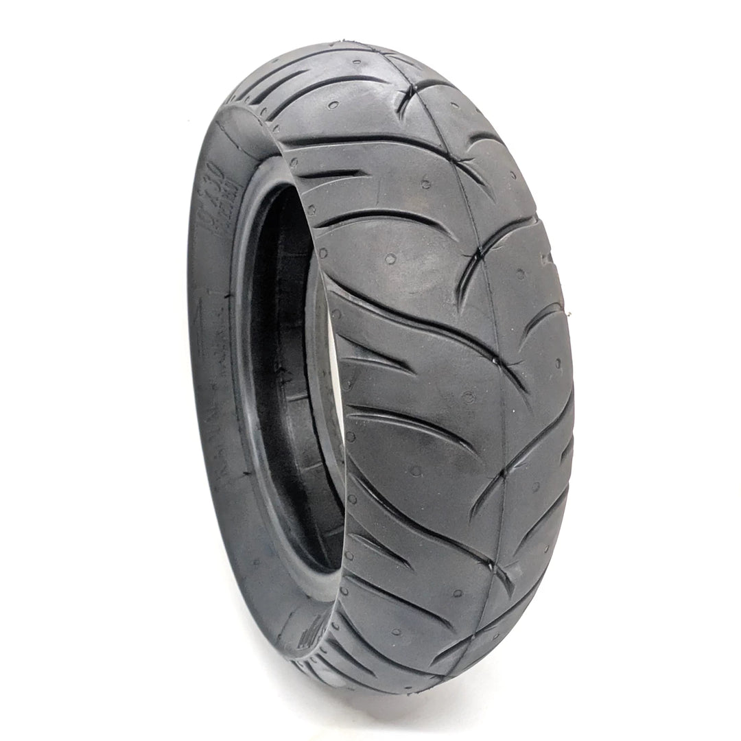 Hero view of the PMT 10x3.0 (75/250-R6.0) E-Fire Radial Tyre, highlighting the unique directional tread pattern.