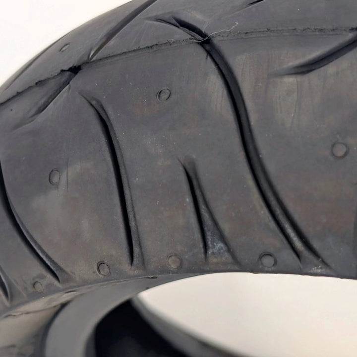 Macro close-up of the stradale tread pattern on the PMT 10x3.0 (75/250-R6.0) E-Fire Radial Tyre 