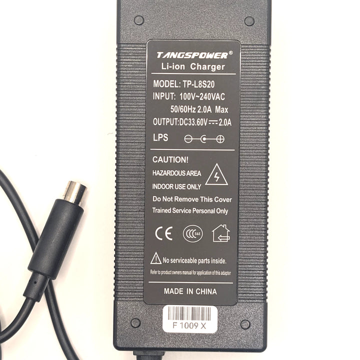 TANGSPOWER TP-L8S20 label showing 33.6V 2A output, 100–240V input and centre-positive polarity