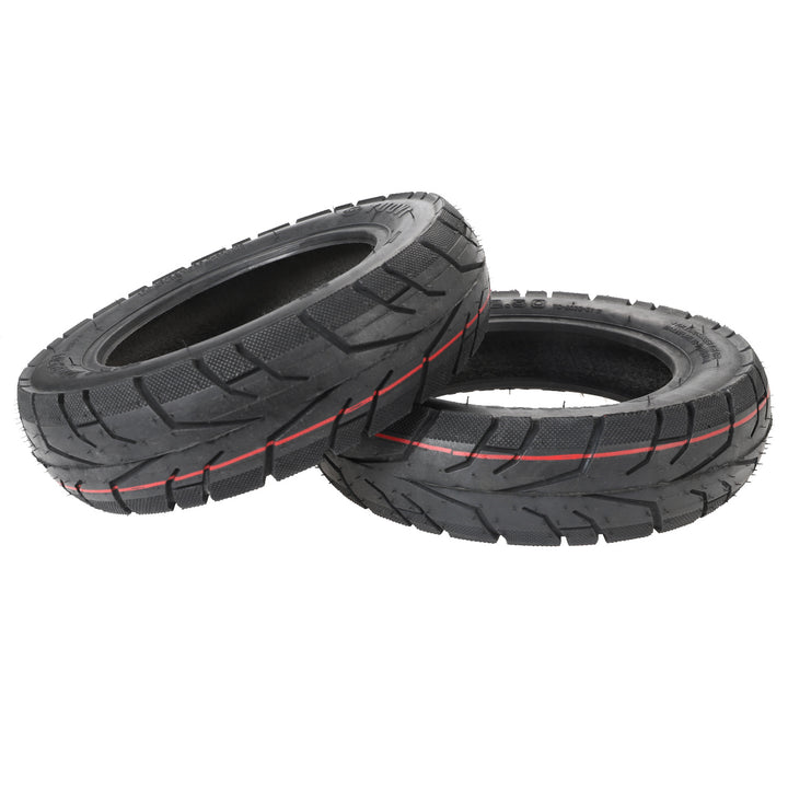 Angled view of two TUOVT 10x2.50 (60/80-6) outer tyres suitable for electric scooters.
