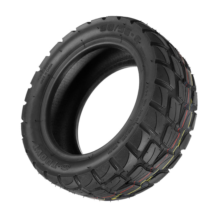 Angled view of TUOVT 90/55-6 vacuum off-road tyre showing deep tread blocks for maximum grip.