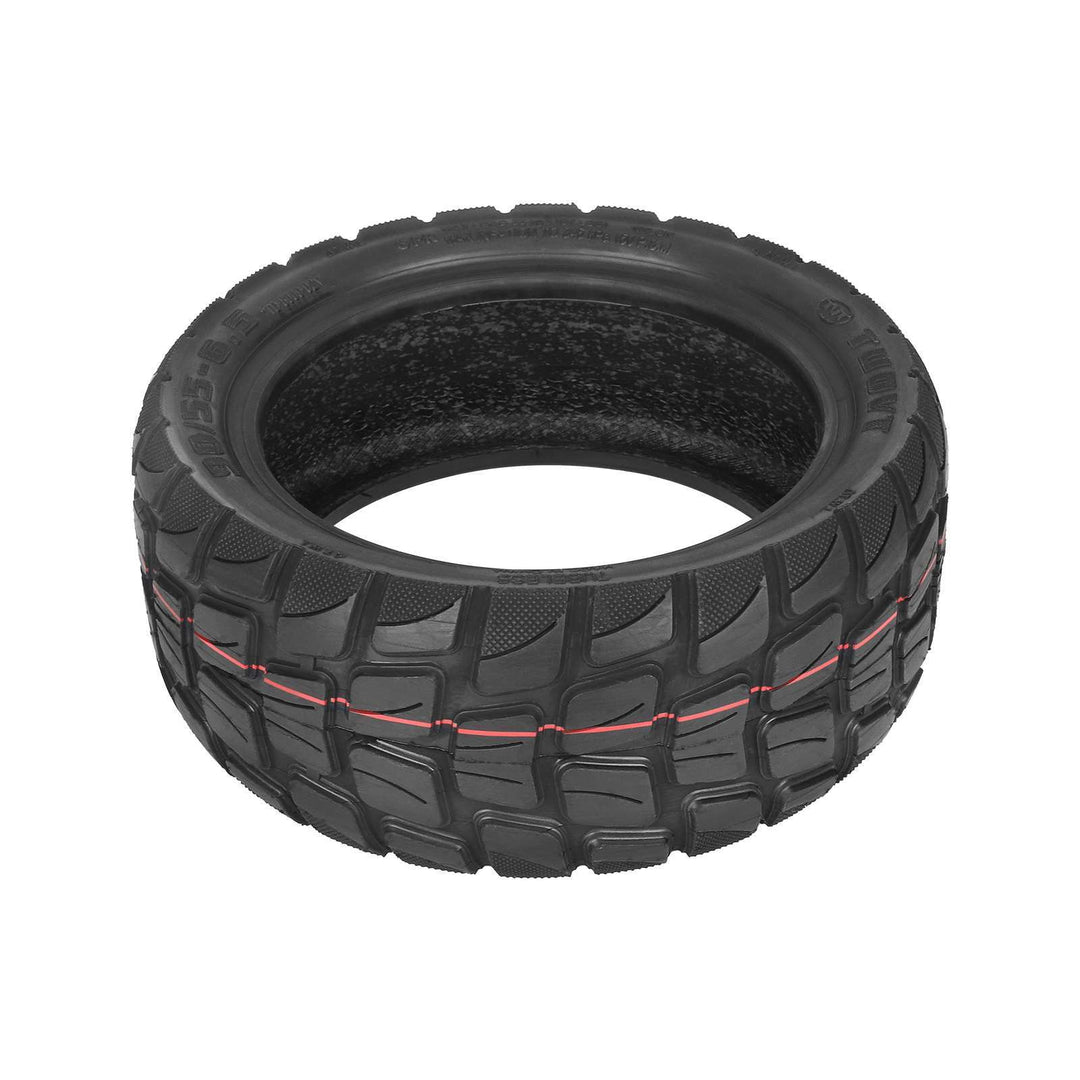 Angled view of TUOVT 90/55-6.5 tubeless off-road electric scooter tyre with block tread pattern.