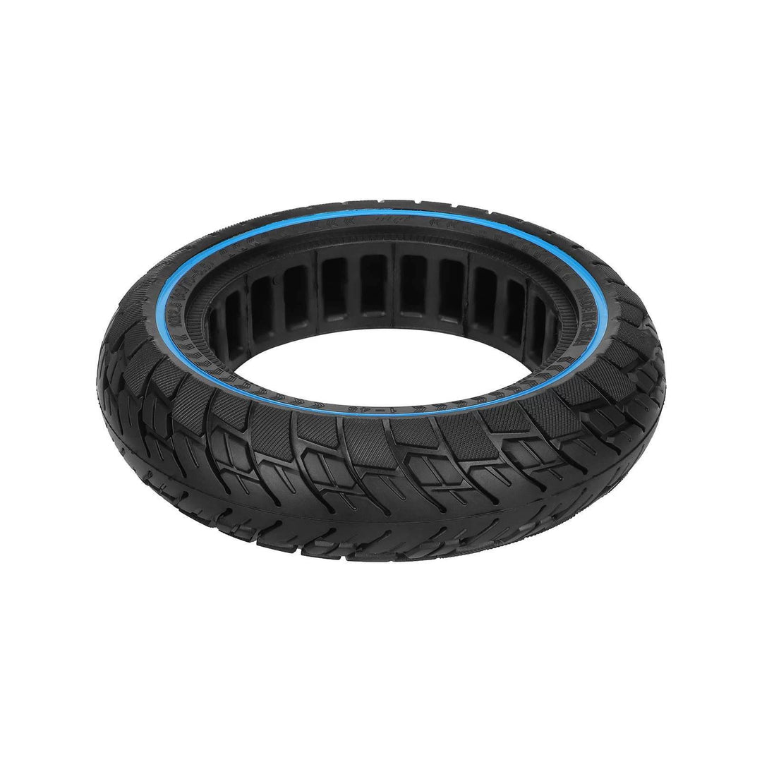ULIP solid tyre lying flat showing off-road tread, blue ring and cavities around the inner core