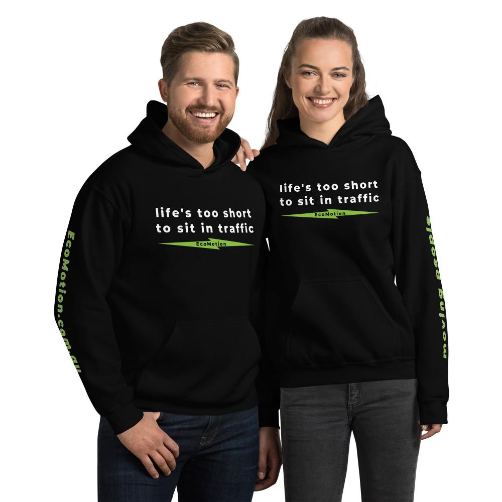 Happy couple in matching "Life's Too Short To Sit In Traffic" EcoMotion hoodies in black, ideal for promoting electric mobility and sustainable fashion.