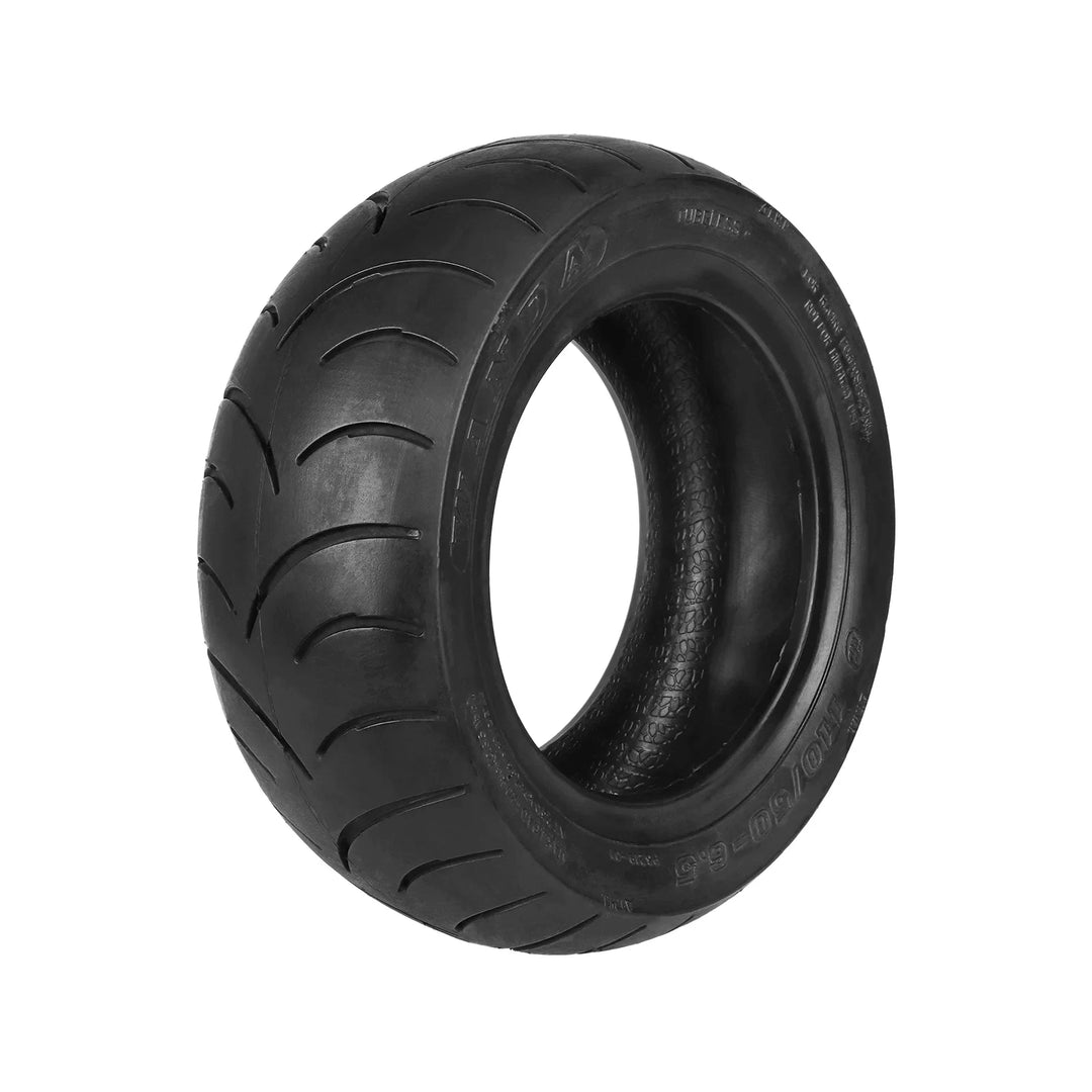 Wanda 110/50-6.5 tubeless racing tyre showing rounded profile and grooved semi-slick tread