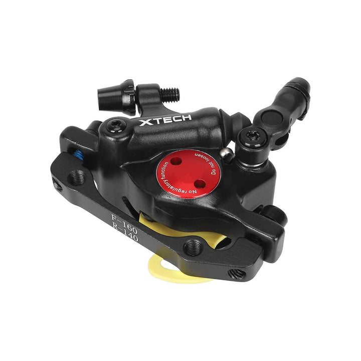 Underside view Xtech Zoom HB100 black hydraulic brake calliper, with removable piston spacer to protect preinstalled brake pads.