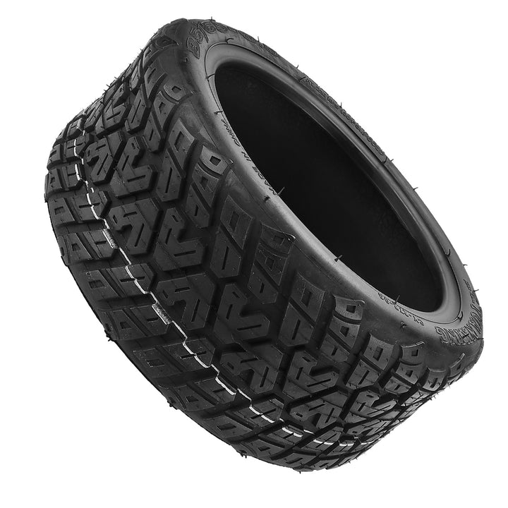 Angled view of Yuanxing 85/65-6.5 off-road electric scooter tyre with reinforced sidewalls.