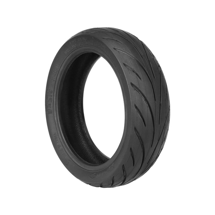 Side angled view of Yuanxing replacement tyre showing 9x2.3 size and rotation arrow
