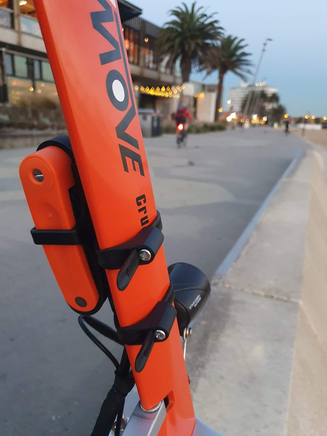 INBIKE Folding Lock stores neatly on the stem of the EMOVE Cruiser (St Kilda Boardwalk, Melbourne, Australia)