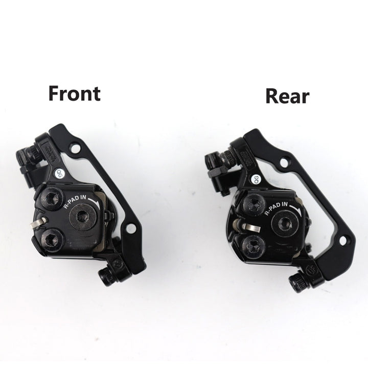 Front and rear Shimano Tourney TX BR-TX805 disc brake callipers, designed for enhanced stopping power and reliability.