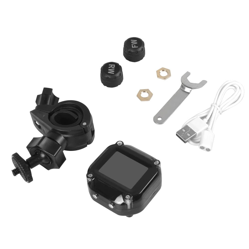 Package contents of the Tyre pressure monitoring system including fitting tools and USB charging cable
